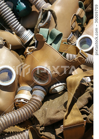 Old vintage worn respirator gas masks close up Old vintage worn respirator gas masks close up 36009709