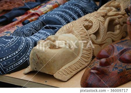 Ethnic wooden carved masks on retail market Ethnic wooden carved masks on retail market 36009717