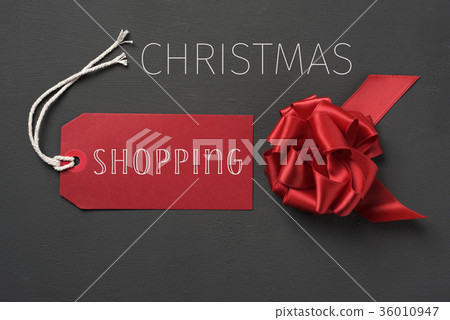 red gift bow and text chrismtas shopping 36010947