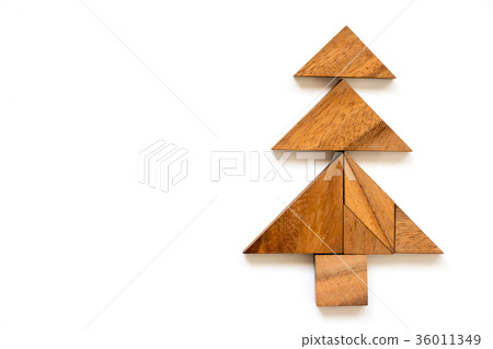 Wood tangram puzzle in christmas tree shape Wood tangram puzzle in christmas tree shape 36011349