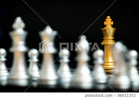 Gold king in chess game face with the silver team Gold king in chess game face with the silver team 36011352