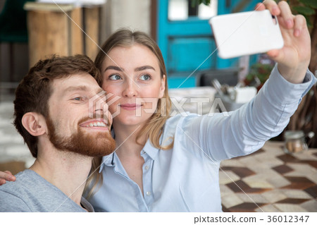 Young couple taking selfie 36012347