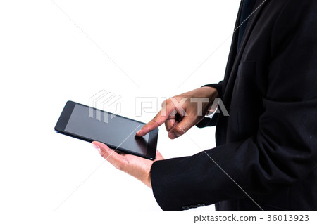 Businessman working with a digital tablet. Businessman working with a digital tablet. 36013923