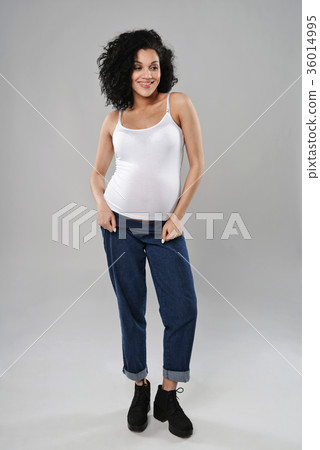 Pregnant woman standing in full length Pregnant woman standing in full length 36014995