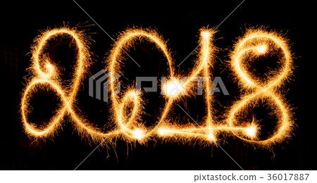 2018 with sparklers on black background 2018 with sparklers on black background 36017887