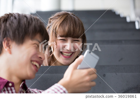 University student smartphone couple University student smartphone couple 36019861