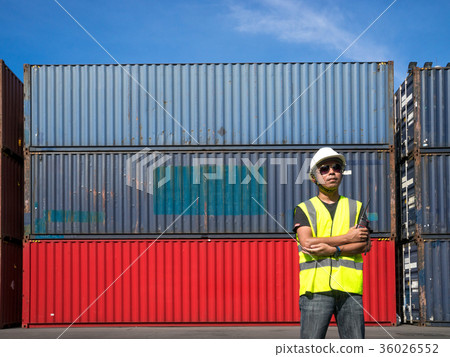 Foreman standing front Containers box from Cargo freight ship fo Foreman standing front Containers box from Cargo freight ship fo 36026552
