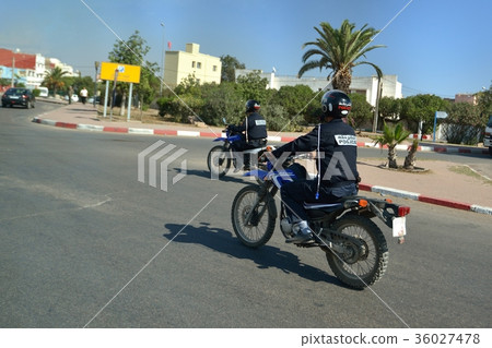 Policeman riding a Moroccan motorcycle 36027478
