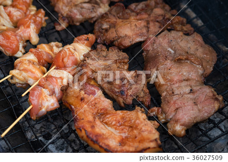 Chicken and pork grill over the small flame 36027509