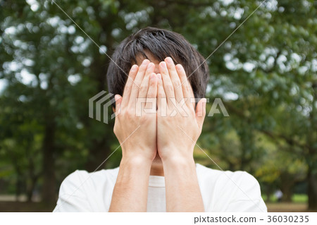Man hiding face 36030235