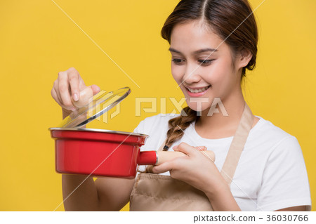 A woman holding a pot A woman holding a pot 36030766