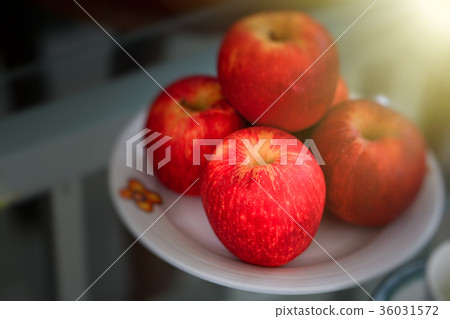 Red apples in a plate on white Red apples in a plate on white 36031572