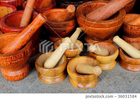 Wood mortar used for grinding or pounding. 36031584