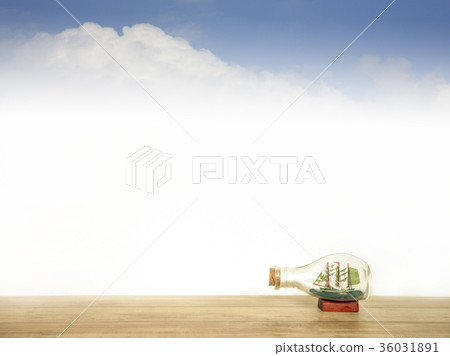 Sailboat in a glass bottle with background sky and Sailboat in a glass bottle with background sky and 36031891
