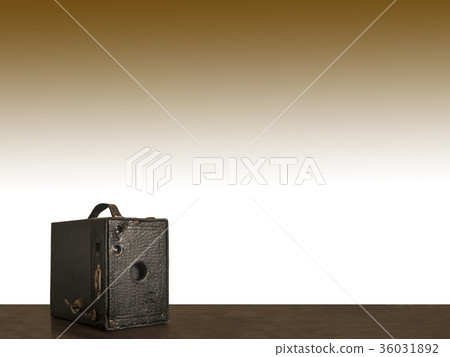 Old box camera with white and brown background  36031892