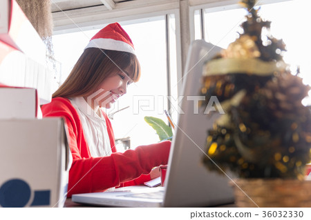 woman wear santa hat check order online business woman wear santa hat check order online business 36032330