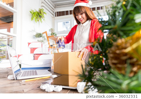 woman wear santa hat packaging product business woman wear santa hat packaging product business 36032331