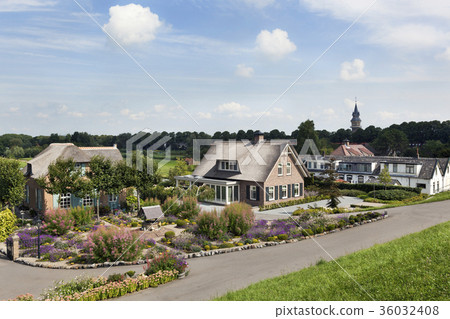 Dike and houses in the Netherlands 36032408
