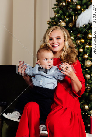 Happy beautiful young mother and her little one Happy beautiful young mother and her little one 36033274