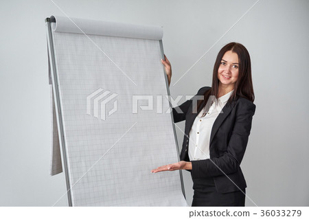 Portrait of young smiling businesswoman standing 36033279