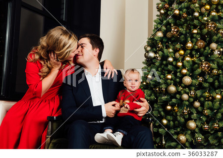 Portrait of a family on a christmas tree Portrait of a family on a christmas tree 36033287