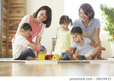 Nursery teacher and children playing 36034415