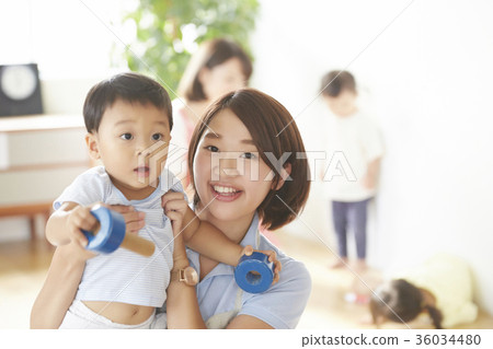 Nursery teacher and children playing 36034480