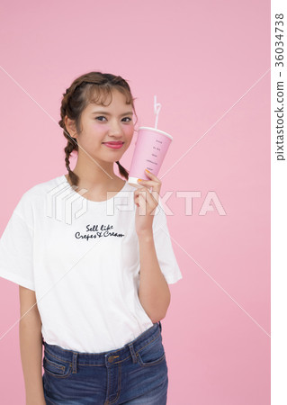 A woman drinking a drink A woman drinking a drink 36034738