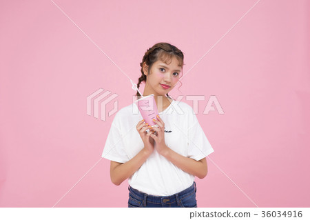 A woman drinking a drink A woman drinking a drink 36034916