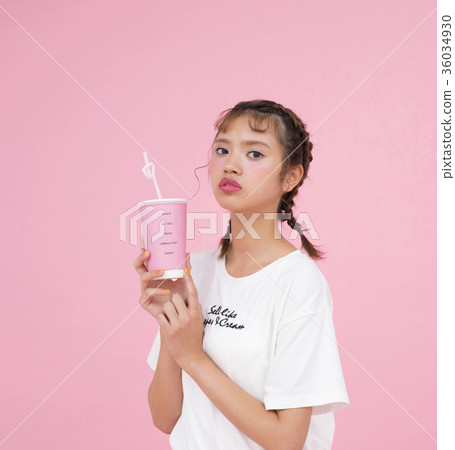 A woman drinking a drink A woman drinking a drink 36034930