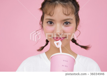 A woman drinking a drink A woman drinking a drink 36034946
