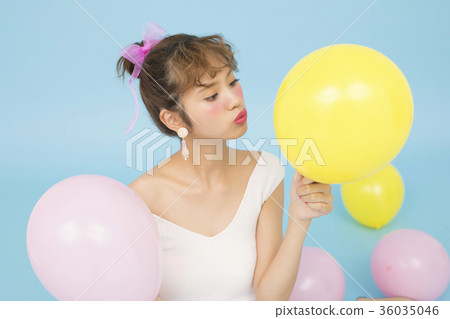 A woman with a balloon A woman with a balloon 36035046