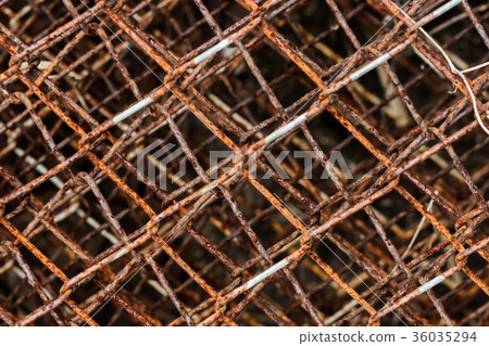 Old wire fence full of rust. 36035294