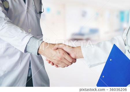 Two Doctor is talking and handshake in hospital. Two Doctor is talking and handshake in hospital. 36036206