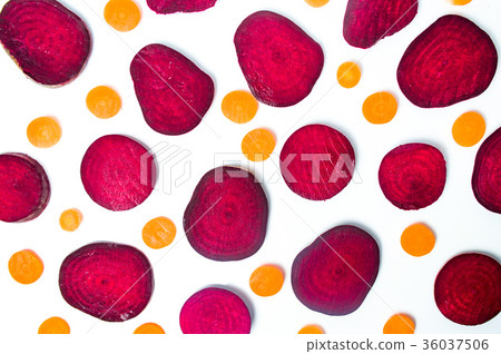 Raw beet and carrot slices isolated on white Raw beet and carrot slices isolated on white 36037506