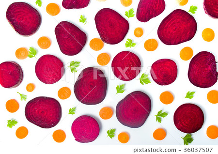 Raw beet and carrot slices isolated on white 36037507