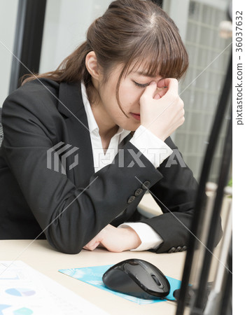 A woman working at the office A woman working at the office 36037632
