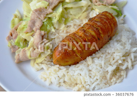 stir fried cabbage and Thai pork sausage on rice stir fried cabbage and Thai pork sausage on rice 36037676