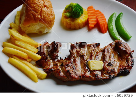 venison steaks and boiled vegetable on white plate venison steaks and boiled vegetable on white plate 36039729