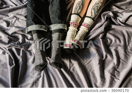 Feet in woollen. Pair relax with a cup of hot Feet in woollen. Pair relax with a cup of hot 36040170