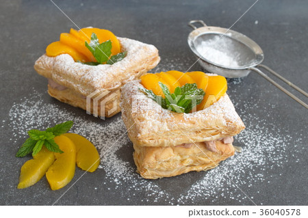 Puff pastry cookies with chocolate cream, apricots 36040578