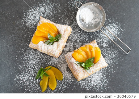 Puff pastry cookies with chocolate cream, apricots Puff pastry cookies with chocolate cream, apricots 36040579