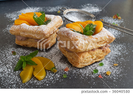 Puff pastry cookies with chocolate cream, apricots Puff pastry cookies with chocolate cream, apricots 36040580