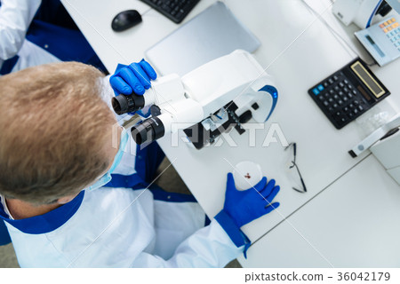Experienced scientist working with blood and 36042179