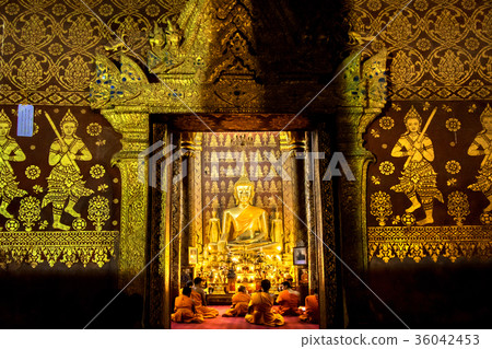 Buddhist monks praying in Wat Mail during Vesak Buddhist monks praying in Wat Mail during Vesak 36042453