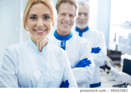Inspired scientists standing together in lab 36042962