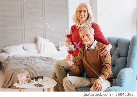 Charming married husband and wife drinking red 36043392