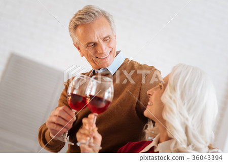 Romantic elderly couple celebrating their Romantic elderly couple celebrating their 36043394