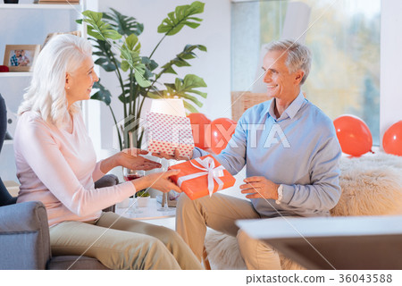 Mindful husband and wife exchanging gifts Mindful husband and wife exchanging gifts 36043588