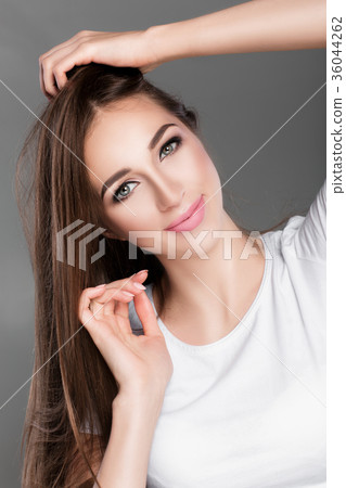 woman with shiny straight long hair. woman with shiny straight long hair. 36044262